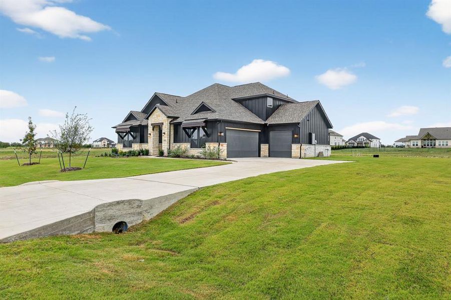 Front exterior of a new home in Highland Crossing, Celina, TX, highlighting curb appeal (Image 2). Front exterior of a new home in Highland Crossing, Celina, TX, highlighting curb appeal (Image 2).