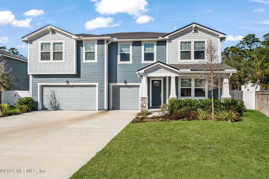 Front exterior of a new home in Olde Mandarin Estates, Jacksonville, FL, highlighting curb appeal (Image 23).