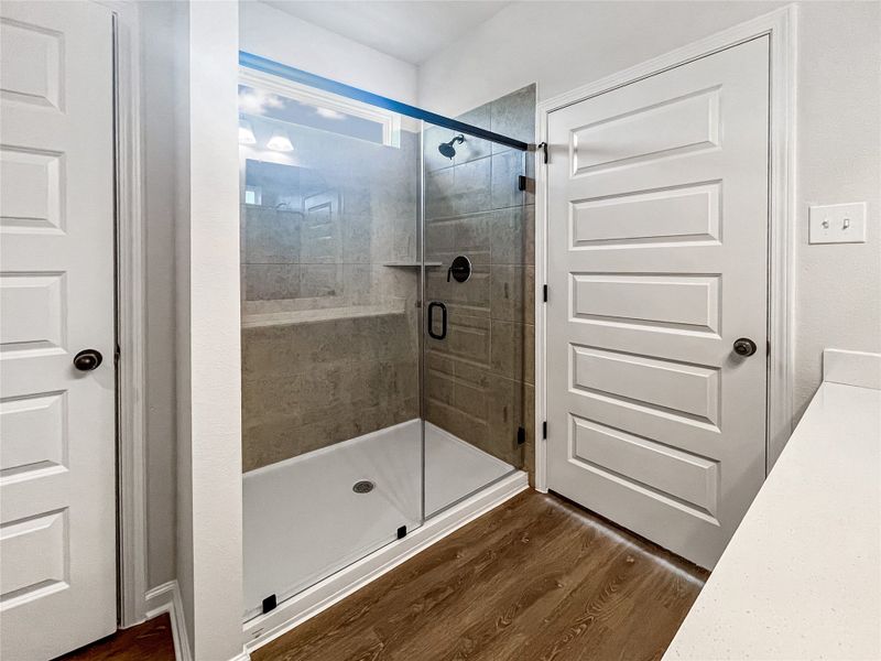 The Princeton II- Primary Bathroom with Dual Vanities and large Walk-in Shower.