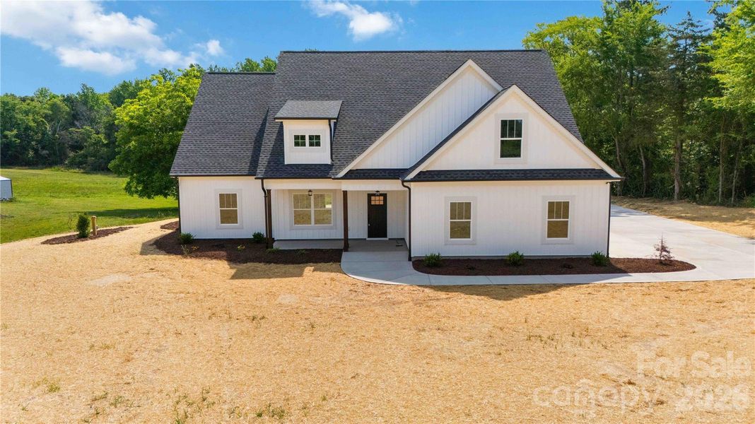Front exterior of a new home in , Clover, SC, highlighting curb appeal (Image 17).