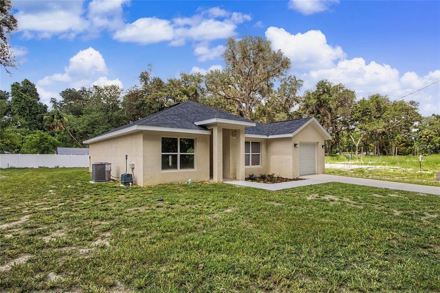 Front exterior of a new home in , Ocala, FL, highlighting curb appeal (Image 2). Front exterior of a new home in , Ocala, FL, highlighting curb appeal (Image 2).
