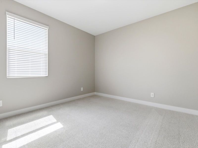 Spacious, unfurnished interior of a new home in White Tank Foothills Signature Series, Waddell (Image 16).