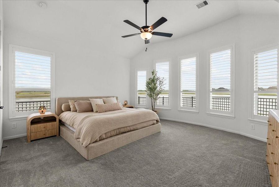 The primary bedroom offers breathtaking water views from every window and features a private spa-like en-suite bath designed for relaxation.
