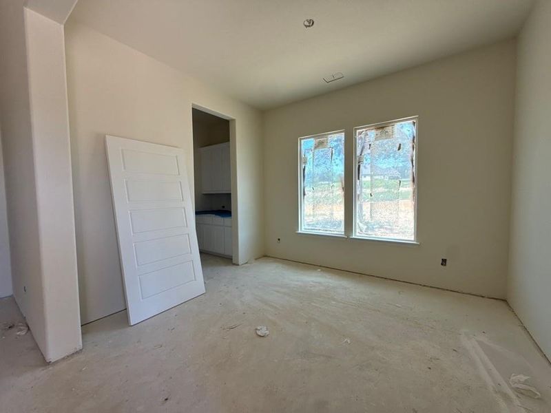 Room featuring two windows, recessed ceiling lighting, and a neutral wall finish