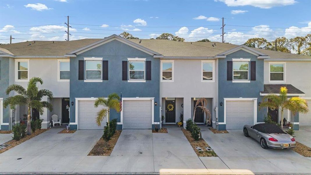 Front exterior of a new home in Azalea Shores, Largo, FL, highlighting curb appeal (Image 25).