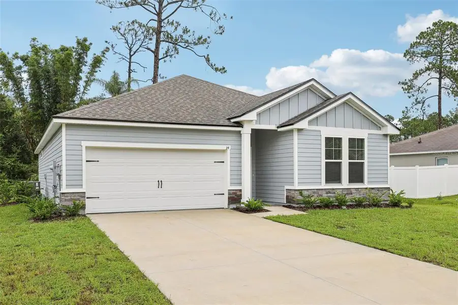 Front exterior of a new home in , Palm Coast, FL, highlighting curb appeal (Image 22).