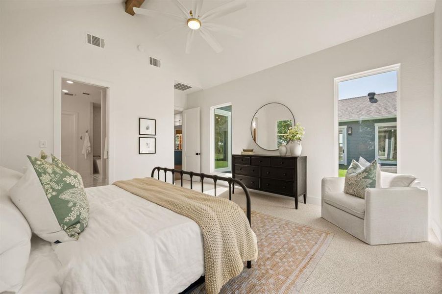 Bedroom with beamed ceiling, carpet flooring, high vaulted ceiling, and a ceiling fan Bedroom with beamed ceiling, carpet flooring, high vaulted ceiling, and a ceiling fan