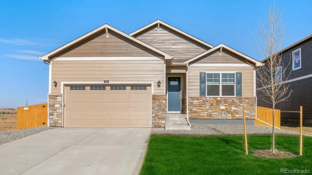 Front exterior of a new home in Spring Valley Ranch, Elizabeth, CO, highlighting curb appeal (Image 1). Front exterior of a new home in Spring Valley Ranch, Elizabeth, CO, highlighting curb appeal (Image 1).