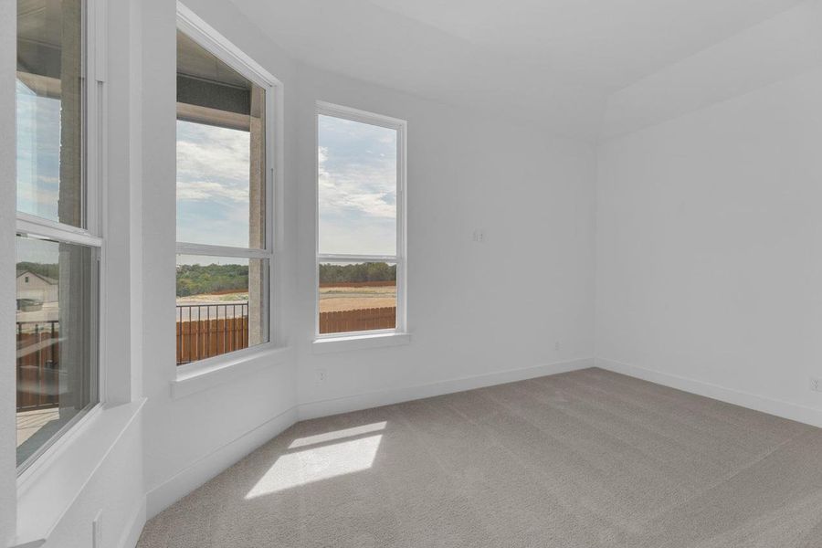 Unfurnished room with light colored carpet and a water view Unfurnished room with light colored carpet and a water view