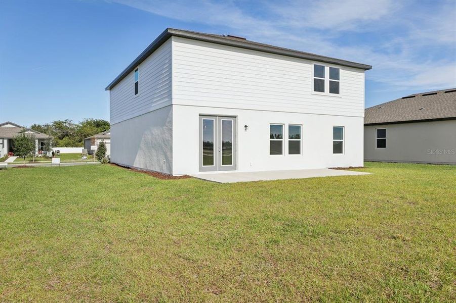 Exterior details and patio area of a home in Tyson Reserve, St. Cloud (Image 19).