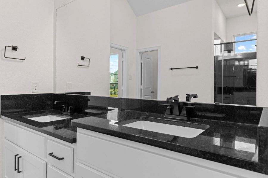 His and her private sink feature beautiful granite countertops, deep undermount sinks, chic custom style bathroom hardware, and lots of cabinet space for all your personal needs. His and her private sink feature beautiful granite countertops, deep undermount sinks, chic custom style bathroom hardware, and lots of cabinet space for all your personal needs.