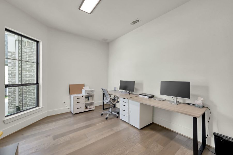 A dedicated home office provides the ideal environment for productivity or quiet reading.