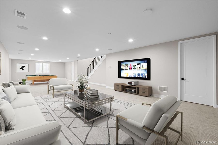 The lower level recreation | media room is made for entertaining. *This photo has been virtually staged.