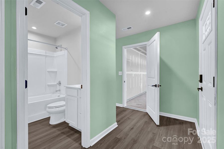 Entrance way, second full bath, entrance to garage