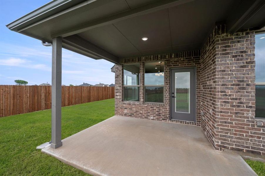 Exterior details and patio area of a home in Coyote Crossing, Godley (Image 3).