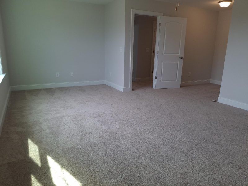 Spacious, unfurnished interior of a new home in Weybridge, Burlington (Image 61).