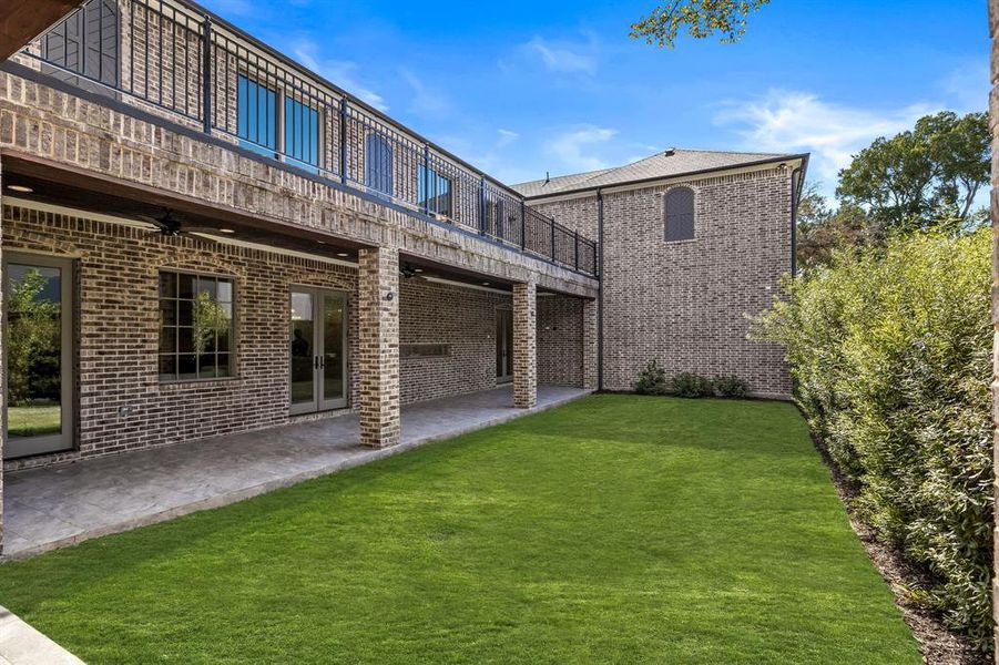 View of yard with ceiling fan and a patio area