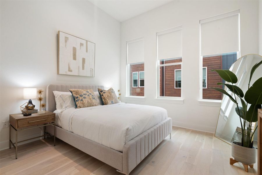 Bedroom with light wood-style floors