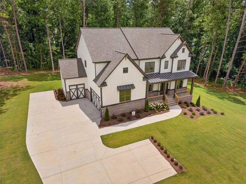 Front exterior of a new home in , Cumming, GA, highlighting curb appeal (Image 31). Front exterior of a new home in , Cumming, GA, highlighting curb appeal (Image 31).