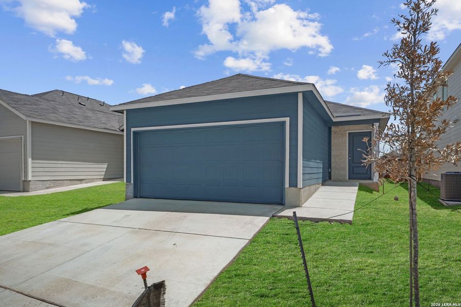 Front exterior of a new home in Valle Sol, Von Ormy, TX, highlighting curb appeal (Image 2). Front exterior of a new home in Valle Sol, Von Ormy, TX, highlighting curb appeal (Image 2).