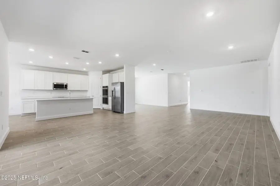 Spacious, unfurnished interior of a new home in Edenbrooke at Hyland Trail | 55+: Edenbrooke at Hyland Trail 60s, Green Cove Springs (Image 13). Spacious, unfurnished interior of a new home in Edenbrooke at Hyland Trail | 55+: Edenbrooke at Hyland Trail 60s, Green Cove Springs (Image 13).