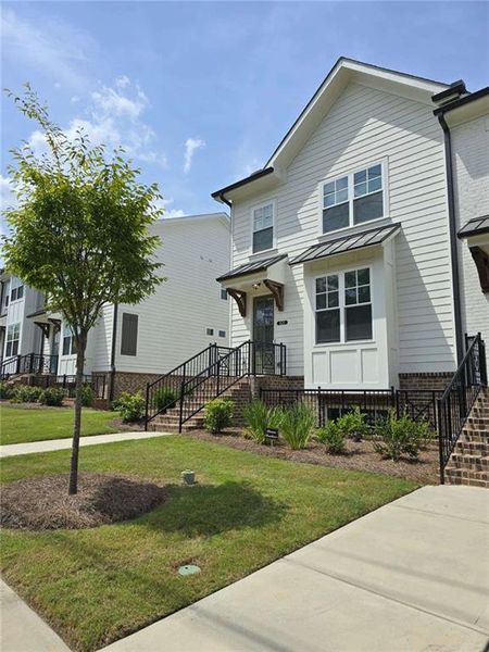 Front exterior of a new home in , Suwanee, GA, highlighting curb appeal (Image 22).