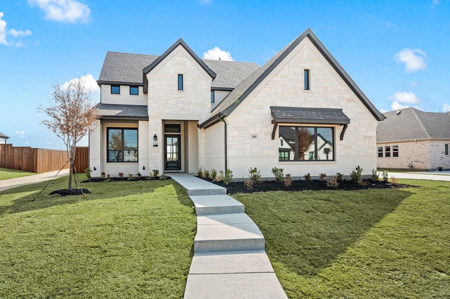 Front exterior of a new home in NorthGlen, Haslet, TX, highlighting curb appeal (Image 27). Front exterior of a new home in NorthGlen, Haslet, TX, highlighting curb appeal (Image 27).