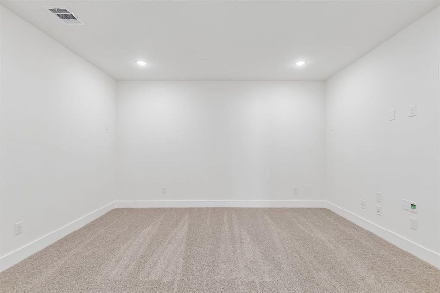 The spacious media room with adjacent game room create the ultimate family entertainment zone! The spacious media room with adjacent game room create the ultimate family entertainment zone!