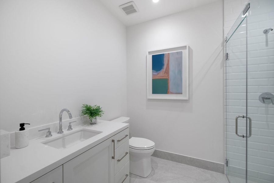 Secondary bathroom with a walk-in shower. Secondary bathroom with a walk-in shower.