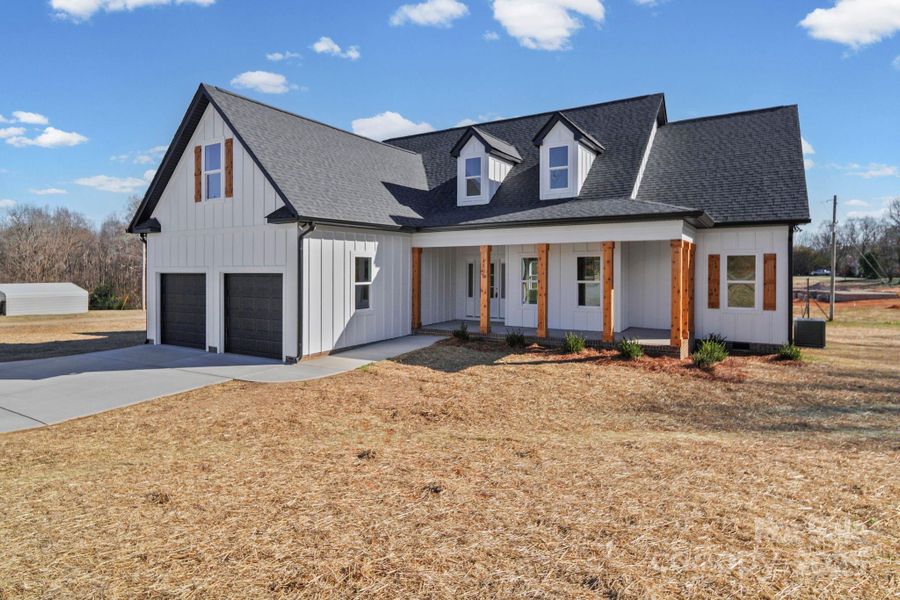 Front exterior of a new home in , Marshville, NC, highlighting curb appeal (Image 23).
