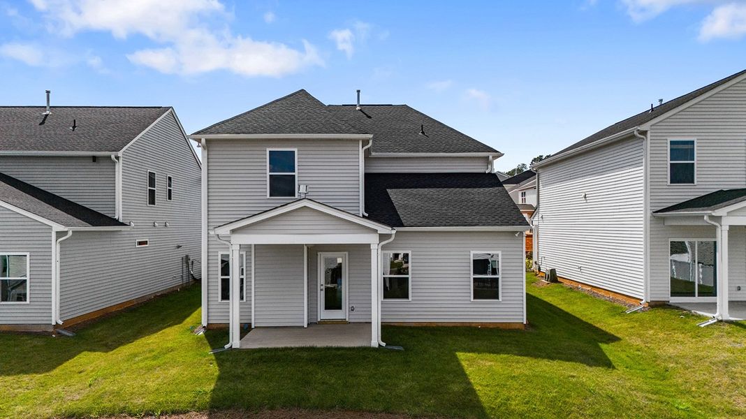 Front exterior of a new home in Hanes Lake, Winston-Salem, NC, highlighting curb appeal (Image 26). Front exterior of a new home in Hanes Lake, Winston-Salem, NC, highlighting curb appeal (Image 26).