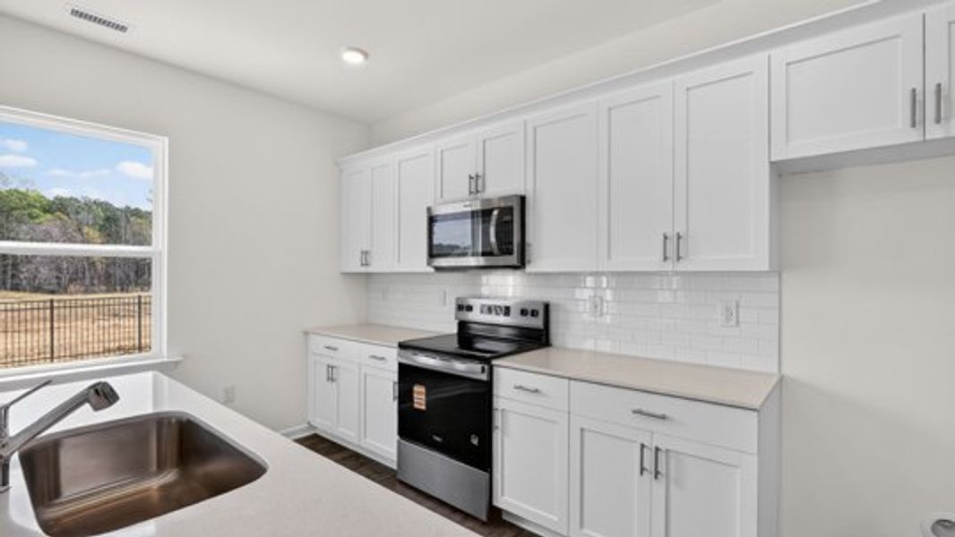 Furnished interior view inside a new home in Shahbain Reserve, Raeford (Image 6).