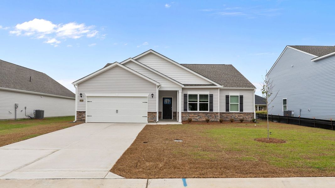 Front exterior of a new home in Villa Grande, Winterville, NC, highlighting curb appeal (Image 2). Front exterior of a new home in Villa Grande, Winterville, NC, highlighting curb appeal (Image 2).