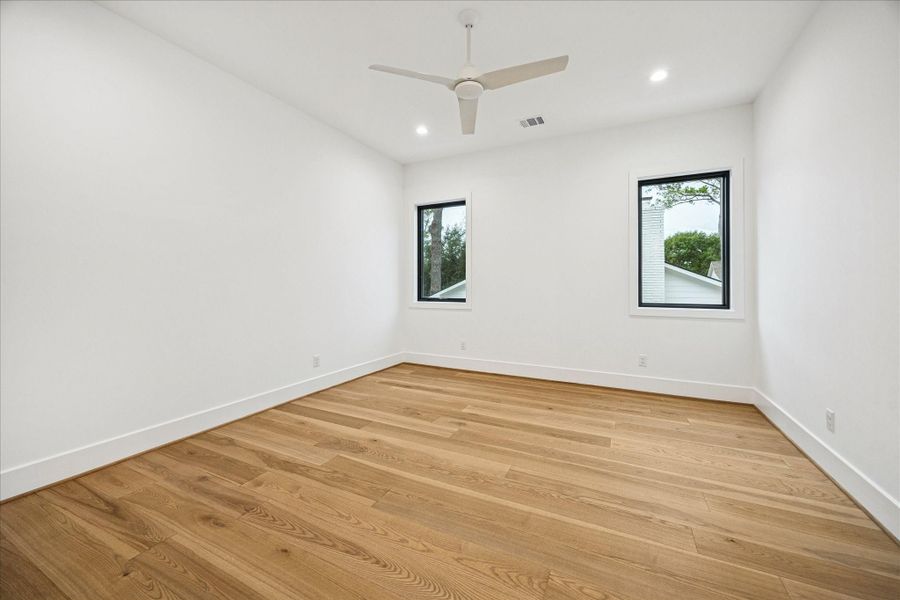 A bright, comfortable space with its own en-suite bath, insulated with open-cell spray foam for quiet, energy-efficient living.