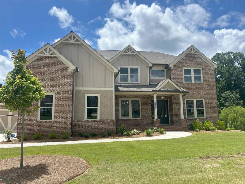 Front exterior of a new home in Sierra Lake, Cumming, GA, highlighting curb appeal (Image 18).