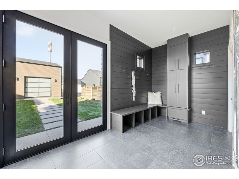 Oversized Mudroom with Built In Cabinets and Lockers