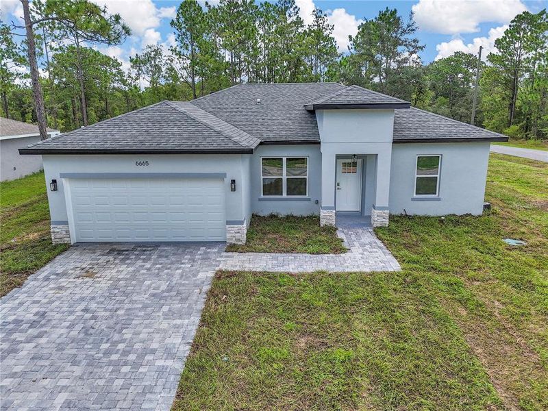 Front exterior of a new home in , Citrus Springs, FL, highlighting curb appeal (Image 19).