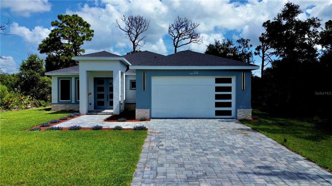 Front exterior of a new home in , Rotonda West, FL, highlighting curb appeal (Image 27). Front exterior of a new home in , Rotonda West, FL, highlighting curb appeal (Image 27).