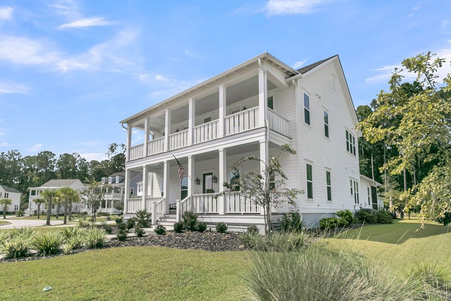 Front exterior of a new home in Carolina Park: Riverside, Mount Pleasant, SC, highlighting curb appeal (Image 24). Front exterior of a new home in Carolina Park: Riverside, Mount Pleasant, SC, highlighting curb appeal (Image 24).