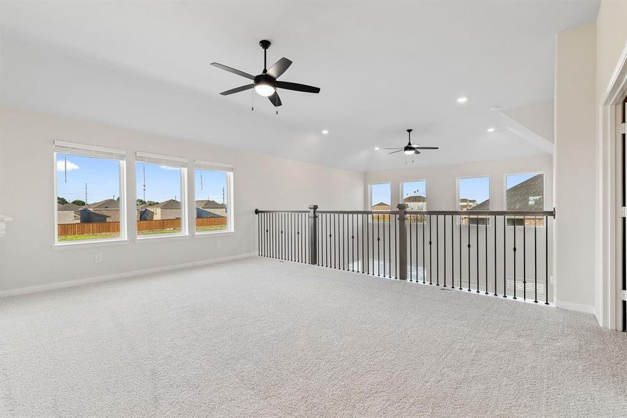 Light, bright and airy, the family fun time never ends in this over the top game room!