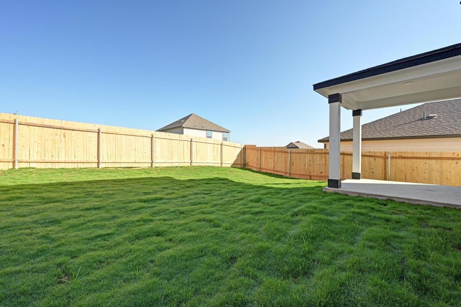 Exterior details and patio area of a home in Creekside at Estancia, Austin (Image 21).