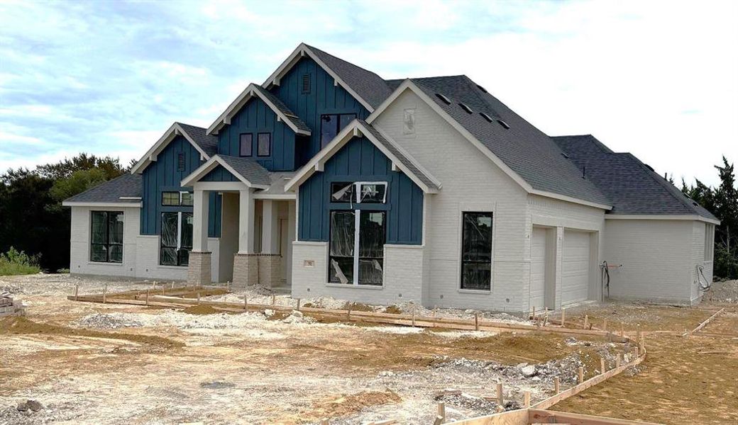 View of front of property with a garage