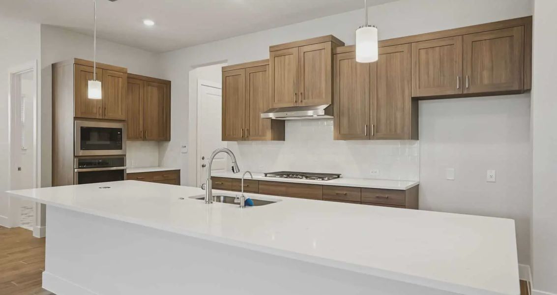 Furnished interior view inside a new home in 6 Creeks, Kyle (Image 4).