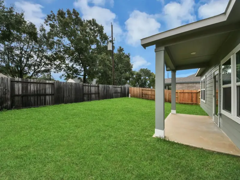 Exterior details and patio area of a home in Windmill Estates, Magnolia (Image 2).