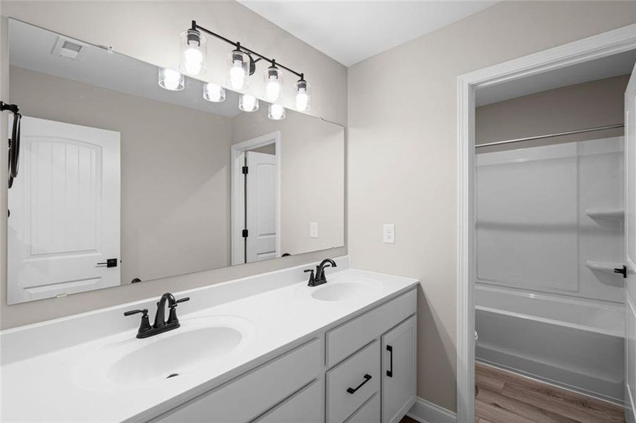 Furnished interior view inside a new home in Hidden Fields, Hoschton (Image 6).