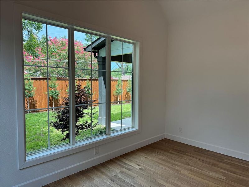 Empty room featuring hardwood / wood-style flooring