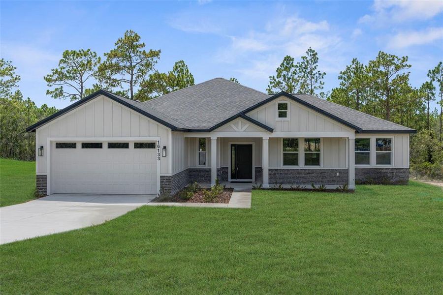 Front exterior of a new home in , Weeki Wachee, FL, highlighting curb appeal (Image 1).