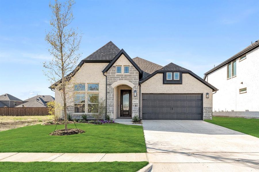 Front exterior of a new home in ArrowBrooke Classic 50, Aubrey, TX, highlighting curb appeal (Image 2).