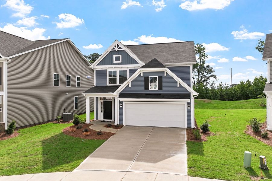 Front exterior of a new home in Renaissance at White Oak, Garner, NC, highlighting curb appeal (Image 19). Front exterior of a new home in Renaissance at White Oak, Garner, NC, highlighting curb appeal (Image 19).