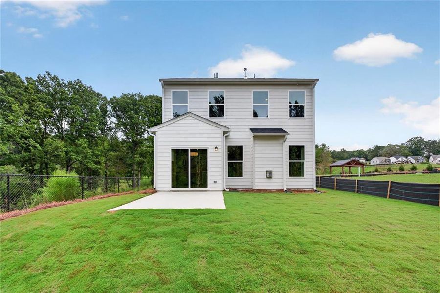Exterior details and patio area of a home in Villas at Dawsonville, Dawsonville (Image 29).